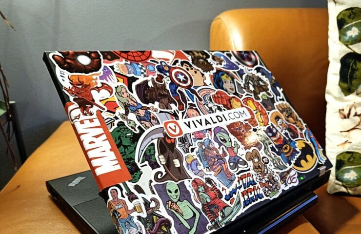 Lenovo W520 laptop with lots of stickers.