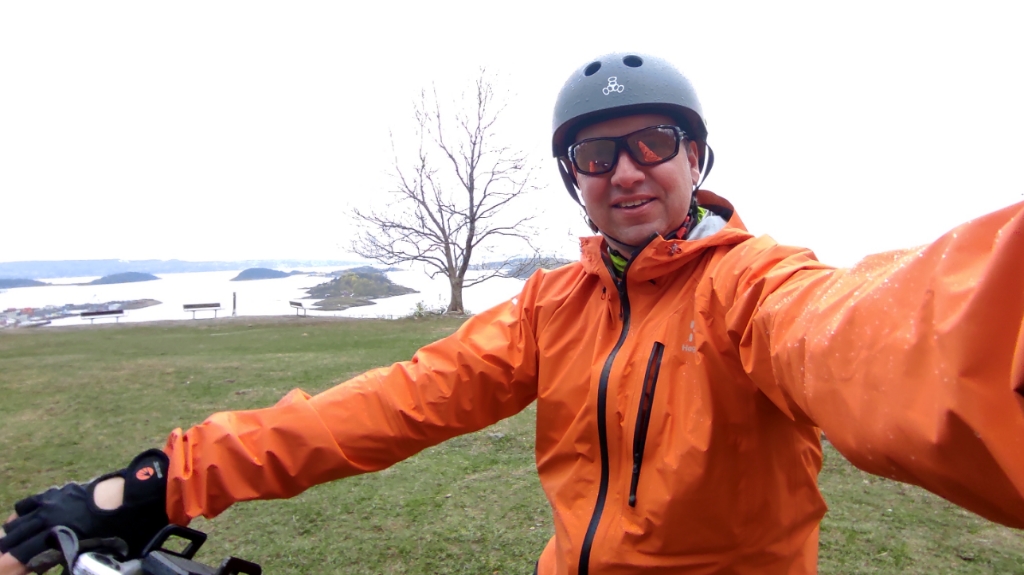 Gaute wearing an Haglöf jacket and a Tripple 8 helmet with the Oslo fjord in the background.
